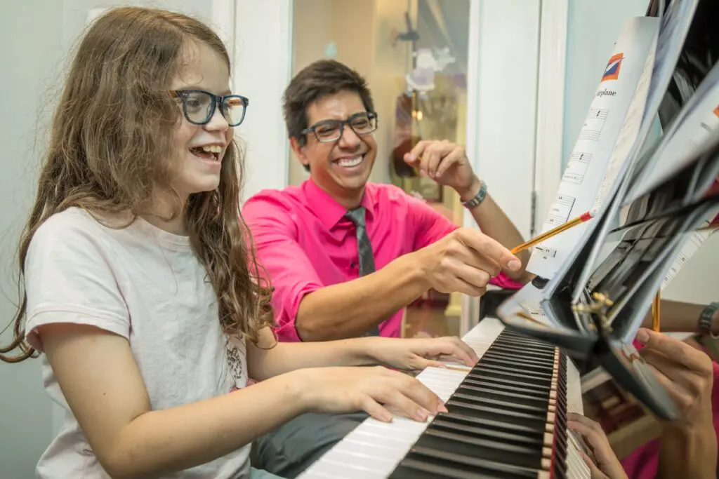 Piano Teacher with Student